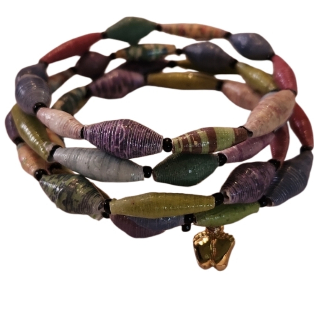 Spiral coil bracelet new condition vintage. Recycled paper beads and foot print